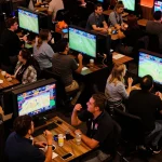 Experience the excitement of sports betting at Max88 with enthusiastic fans placing their bets.