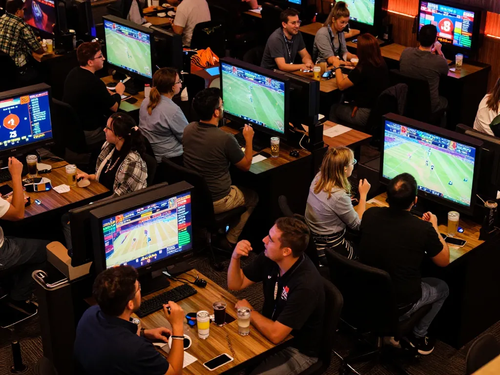 Experience the excitement of sports betting at Max88 with enthusiastic fans placing their bets.